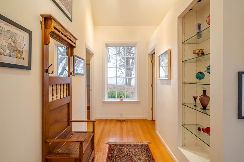 Entryway facing window to backyard, full bath to the right