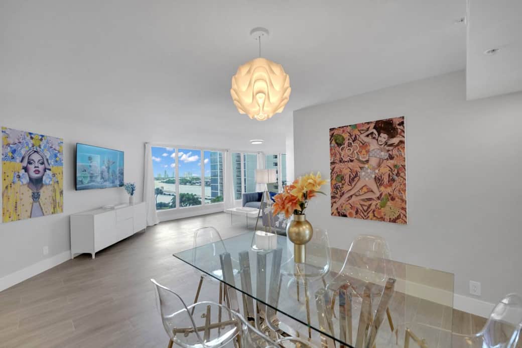 Dining area with seating for 6, living room with 65" Roku streaming tv, views of Biscayne Bay