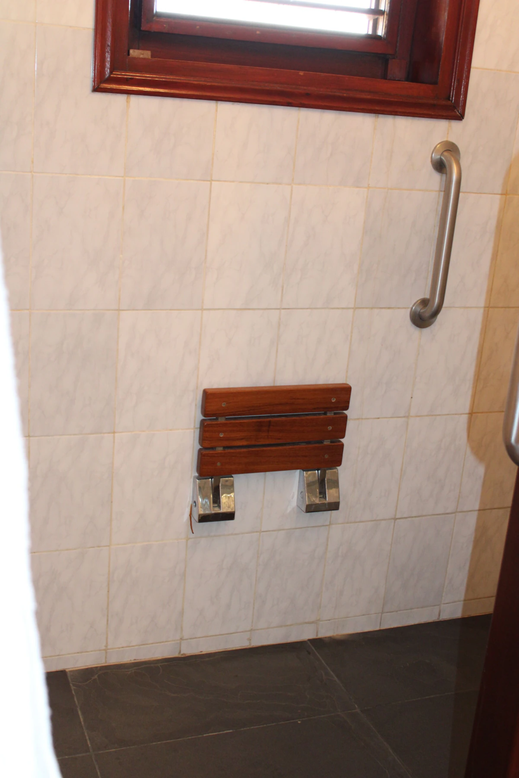 Both bathrooms have a shower seat and handrails for support and safety