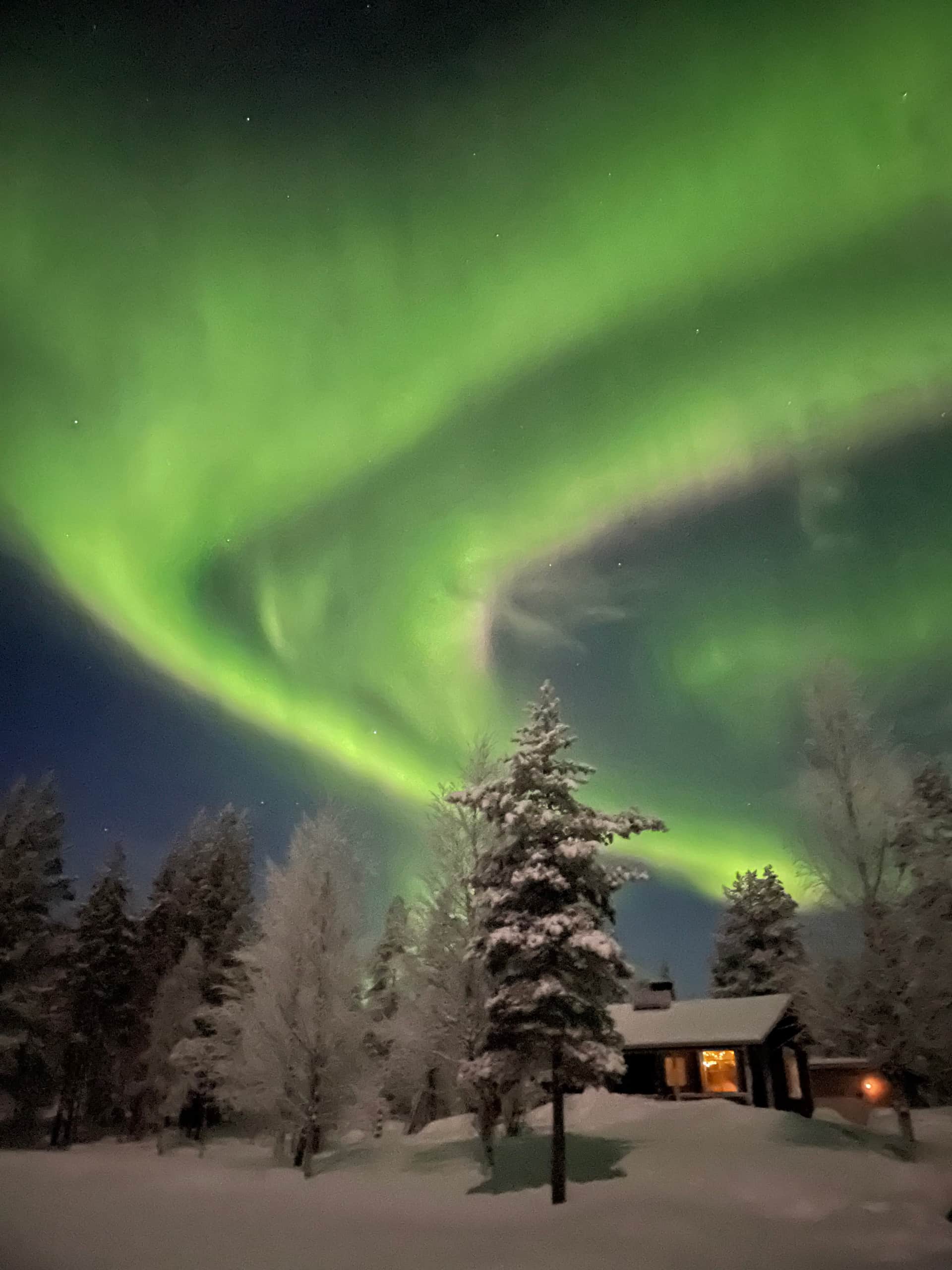 Aurora over the Lapland Forest Cabin