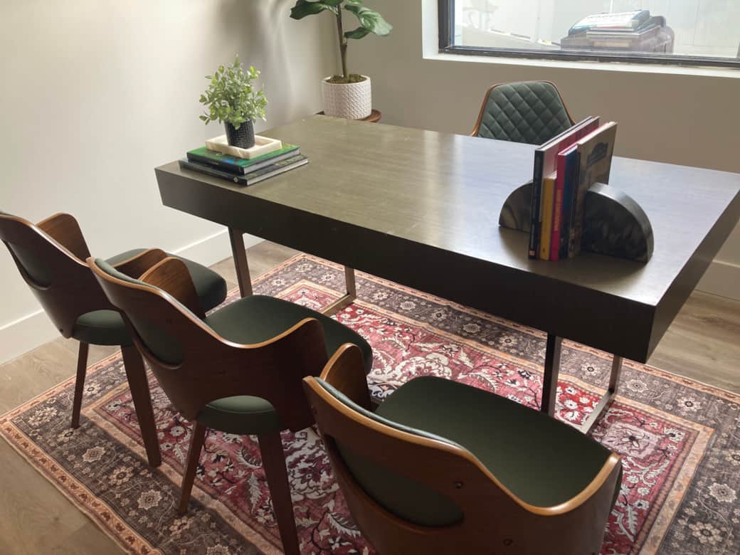 Stylish office nook with elegant details, lush greenery, and a premium rug.  Lakeland, FL