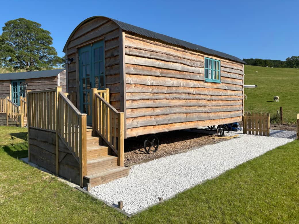Rustic shepherd hut with private steps, garden space and open countryside views.