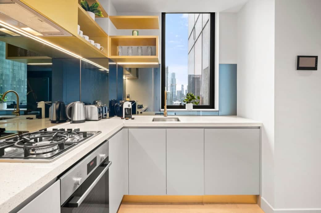 Fully equipped modern kitchen with gas cooktop, oven, microwave, and dishwasher, plus essential cookware and utensils. Includes a Lavazza coffee machine, kettle, and toaster — perfect for easy meals and a great start to your day