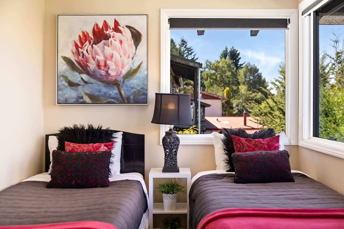 Third bedroom with two single beds at Walk to Town 41A Alpine Chalet Queenstown sleeps 6