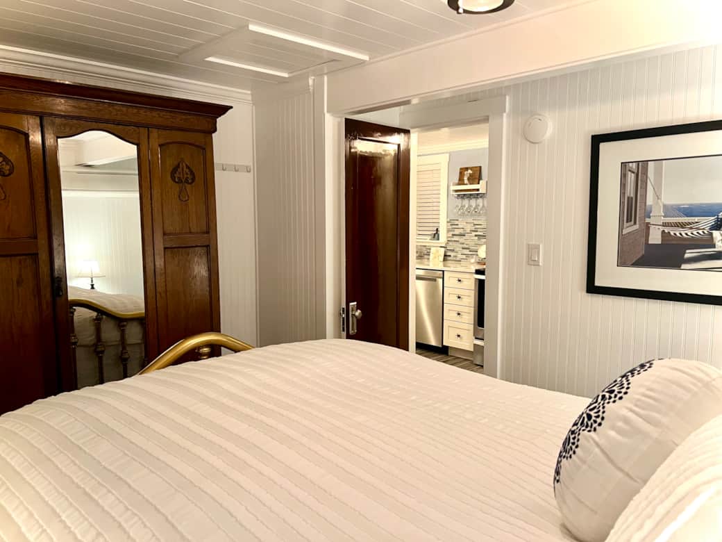 Brass Bed and Antique Armoire