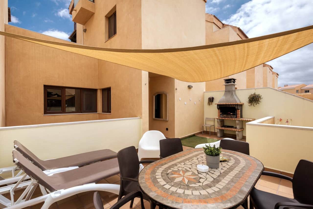 Large Rear Terrace with sun shades, BBQ, Dining area and loungers