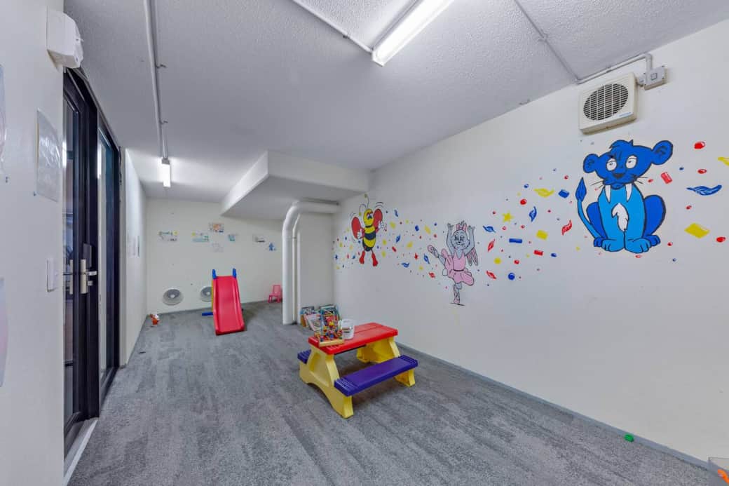Children's playroom located next to gym / fitness centre