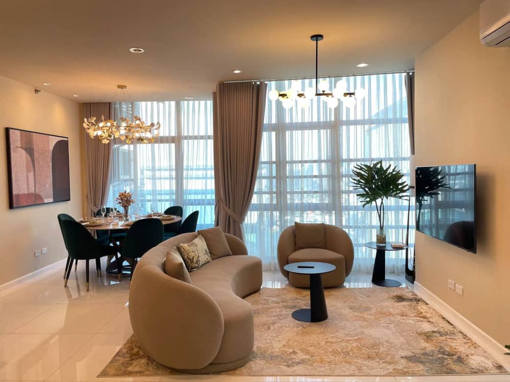 The inviting and spacious living area boasts a beautifully designed dining table that comfortably seats six, perfect for gatherings and memorable meals with family and friends. The inviting and spacious living area boasts a beautifully designed dining table that comfortably seats six, perfect for gatherings and memorable meals with family and friends.