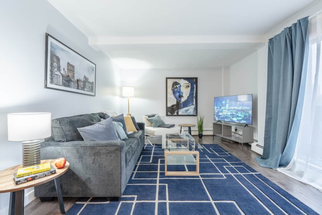 This comfy living room comes with a smart TV so you can stream your favourite shows and movies. The couch pulls out into a bed for the ultimate lounging experience! 