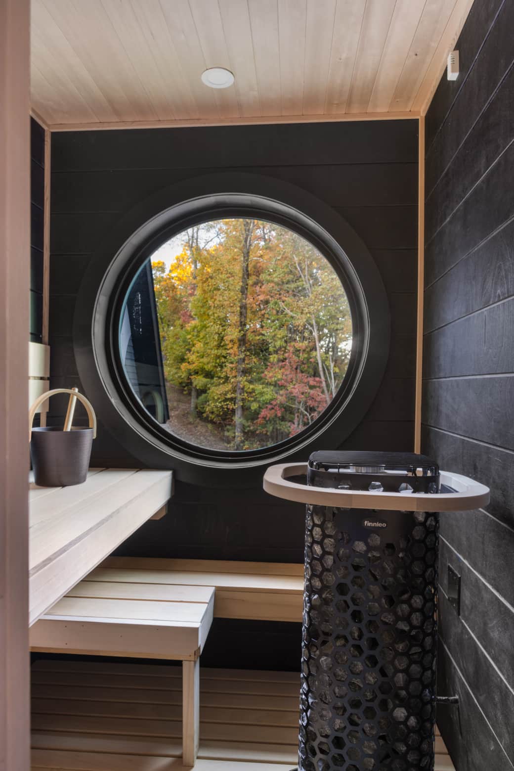 Primary suite sauna featuring dark wood finishes for a spa-like retreat.