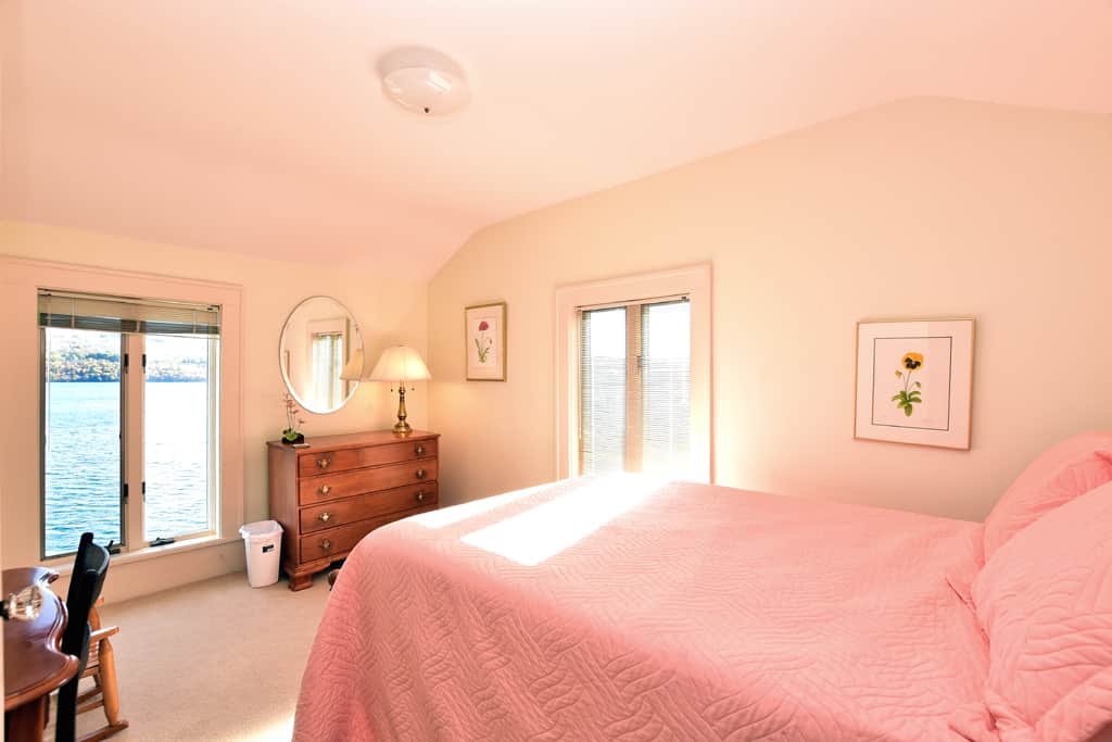 Upstairs bedroom with full bed, closet, desk, TV.  Beautiful lake views.