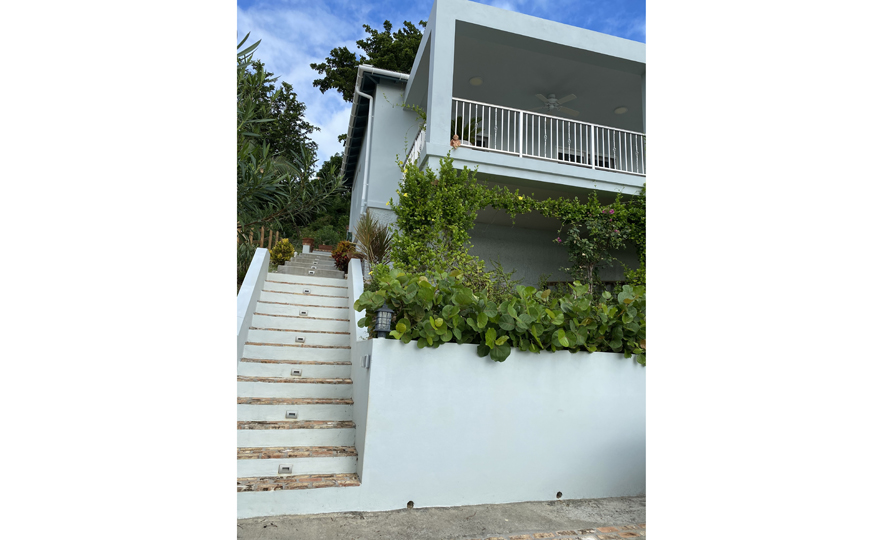 Concrete parking directly off the road, steps to your entrance