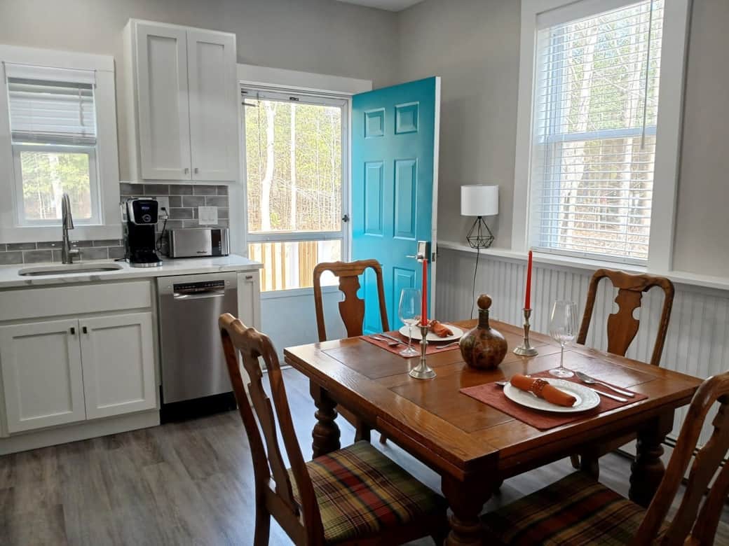 Kitchen dining area with back door leading to porch and backyard Kitchen dining area with back door leading to porch and backyard