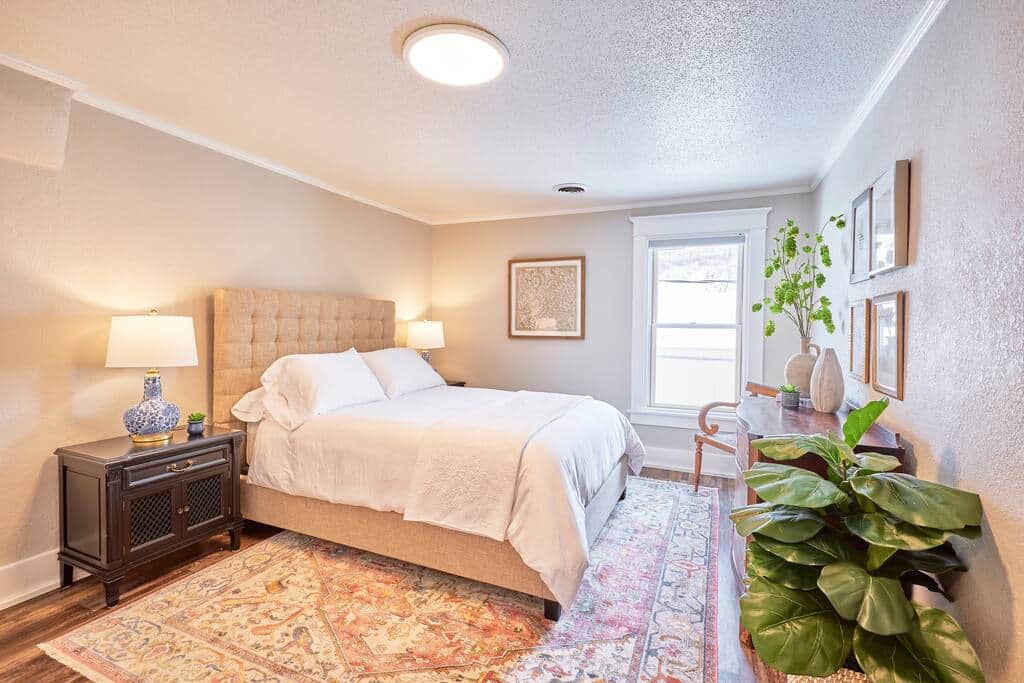 Get a good night's sleep in a queen-sized bed with crisp white sheets.