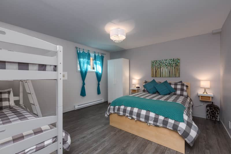 3nd bedroom with a double bed, 2 bunk beds and storage