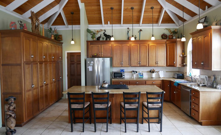 View of the custom mahogany cabinets and stainless steel appliances.
