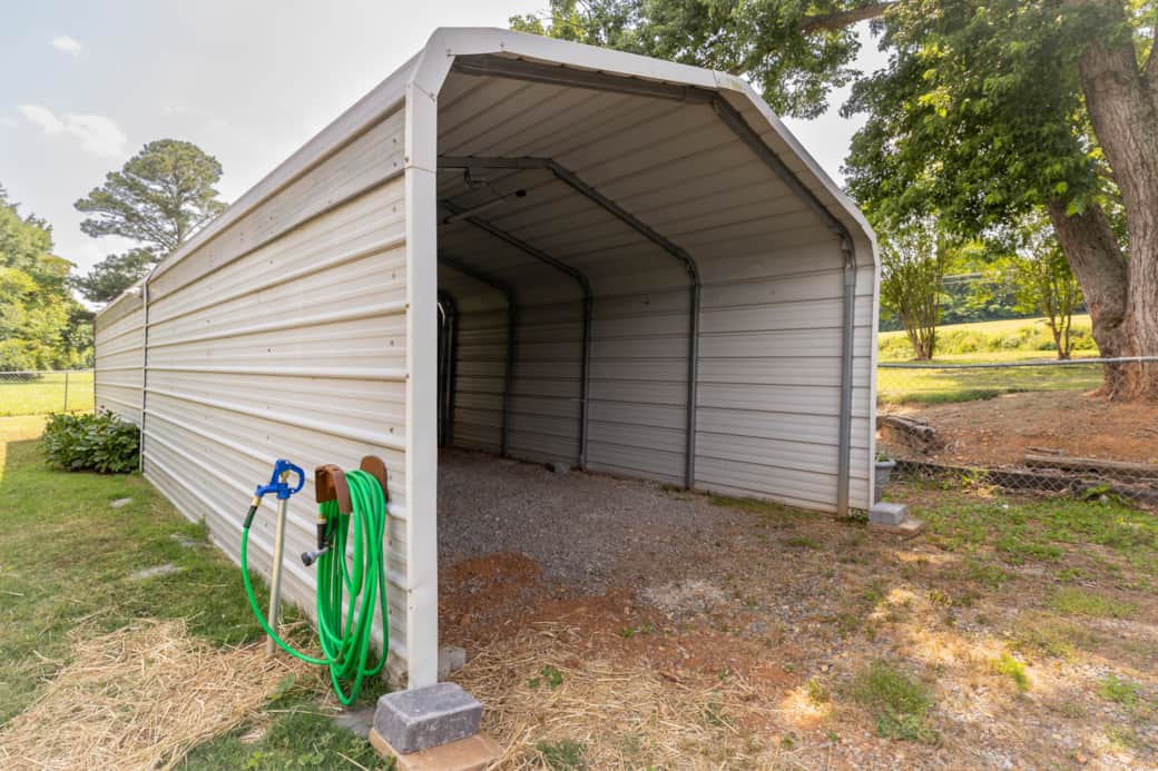 Covered Parking has water access with hose and nozzle provided. Perfect for cleaning boats, .