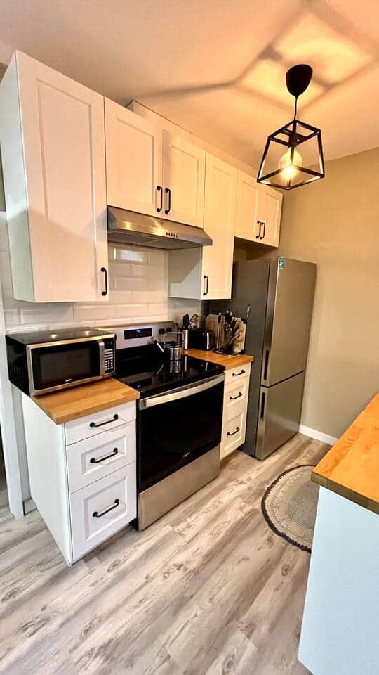 Modern, well-equipped kitchen with stainless appliances & butcher block counters Modern, well-equipped kitchen with stainless appliances & butcher block counters