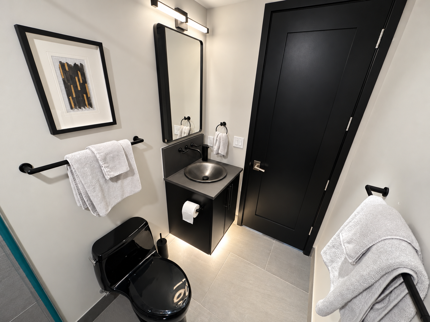 Vanity and entry in the full bathroom serving the study.
