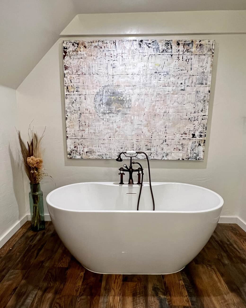 Tranquil and thoughtfully stocked. This upstairs bath features a peaceful soaking tub, soft lighting, handcrafted wood accents, and calming original artwork. We’ve included the little extras you might need, so you can simply relax and enjoy your stay