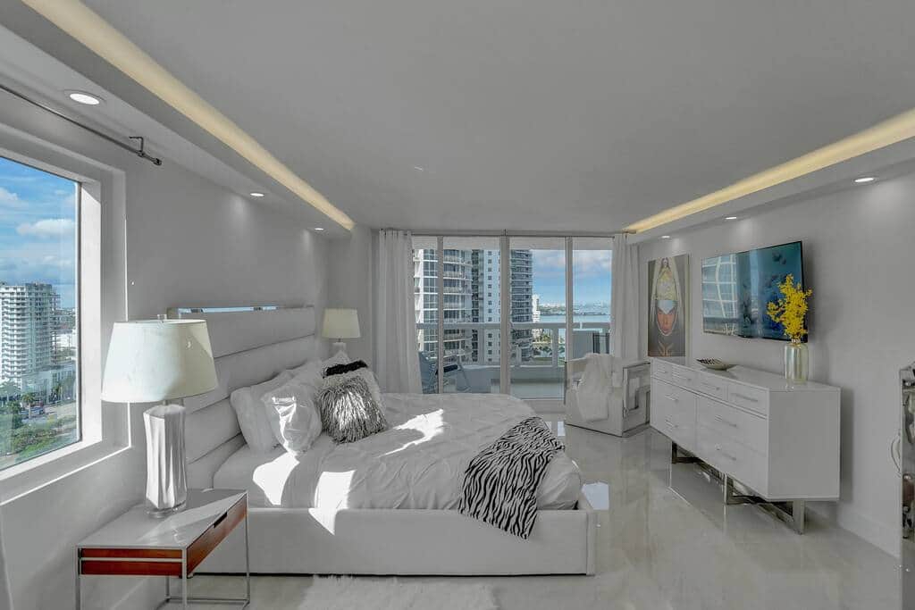 Master bedroom suite, king bed, Roku tv, balcony access, desk, bathroom