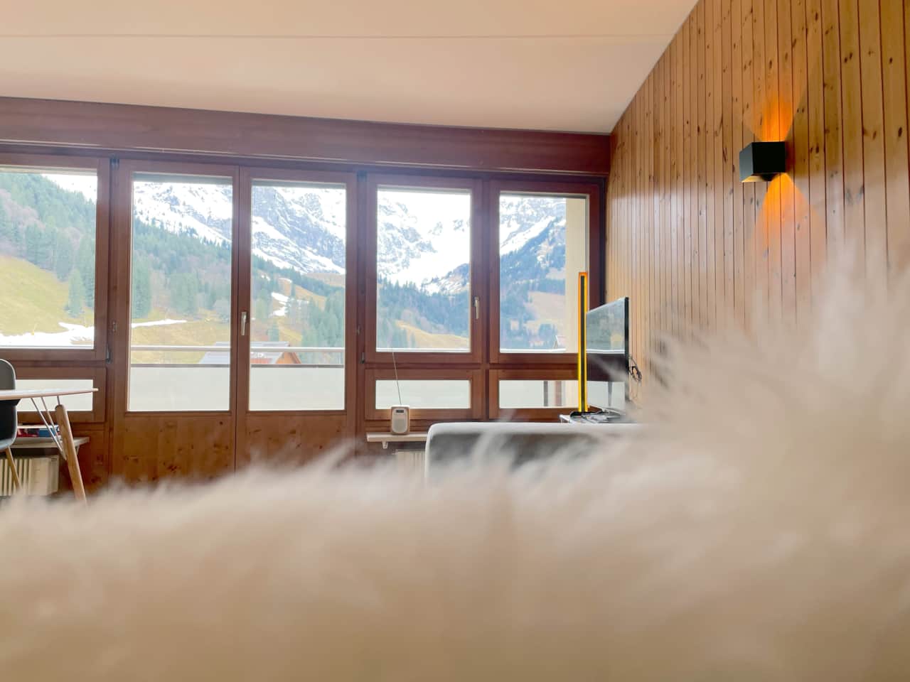 The view of the Swiss Alps from the sofa lounge at Titlis Lodge Engelberg.