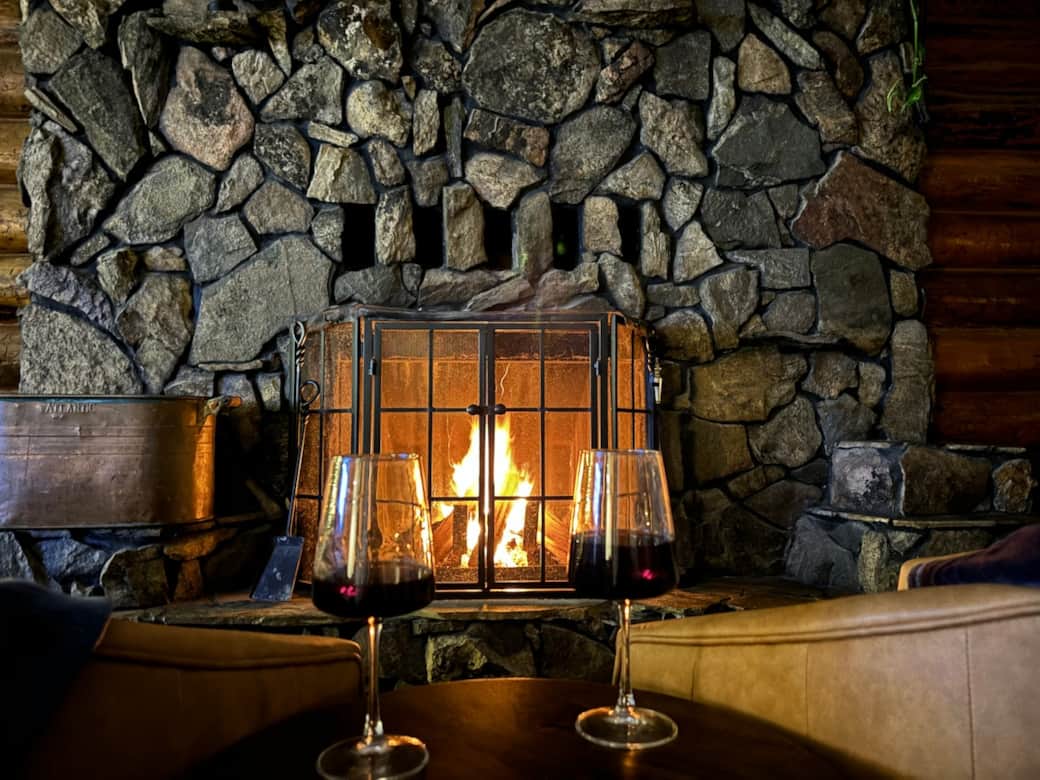 Cozy up with a glass of wine by the wood-burning fireplace.