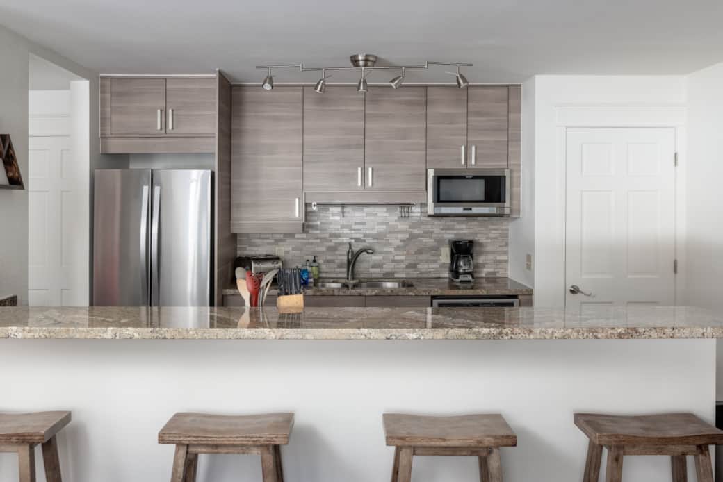 The kitchen at Smuggler Mine features stainless steel appliances and granite countertops