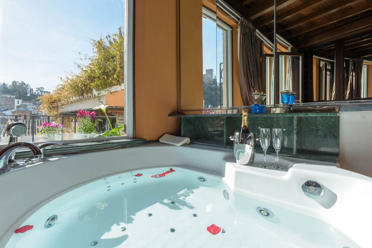 Master bedroom with jacuzzi with Alhambra views