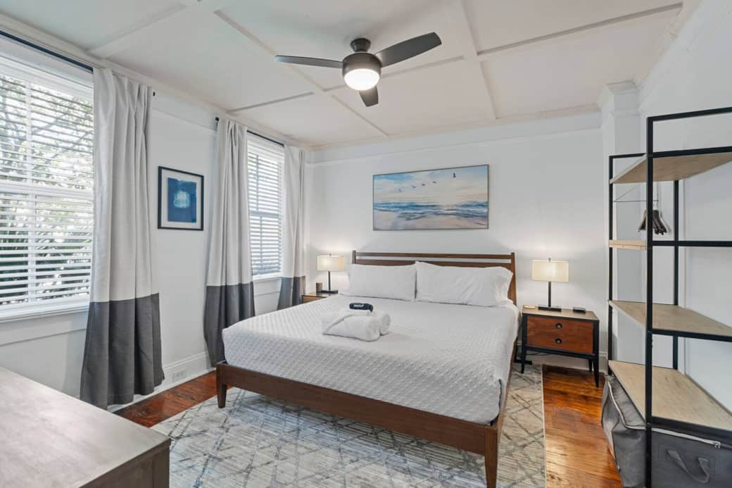 Bedroom #1 KING bed with two bed-side tables/lamps, large shelf and large dresser. Two large windows w/light blocking blinds & curtains. Two styles of pillows are provided - one soft and the other more firm w/protective covers - including mattress.