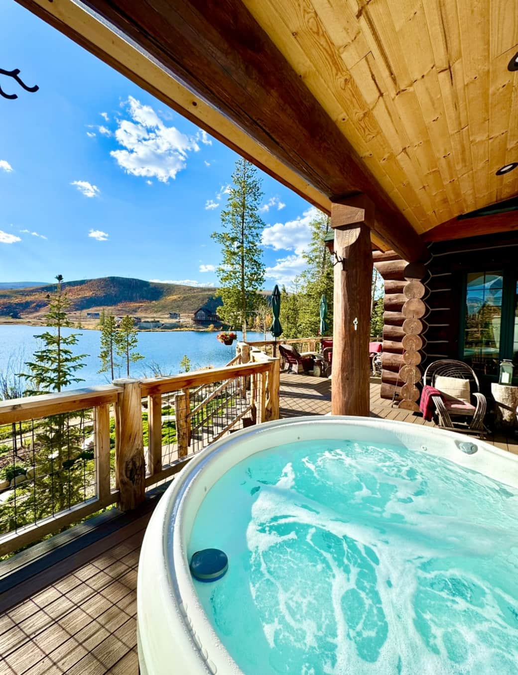 Hot tub on covered deck overlooking lake