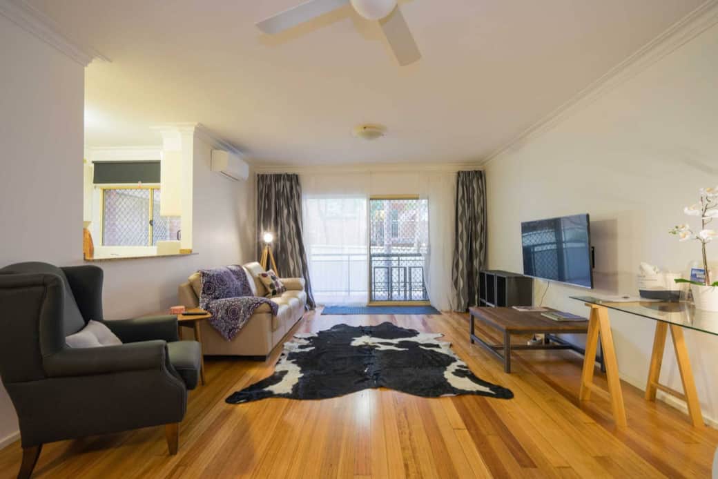 A big screen Smart TV for gaming and office desk overlooking garden