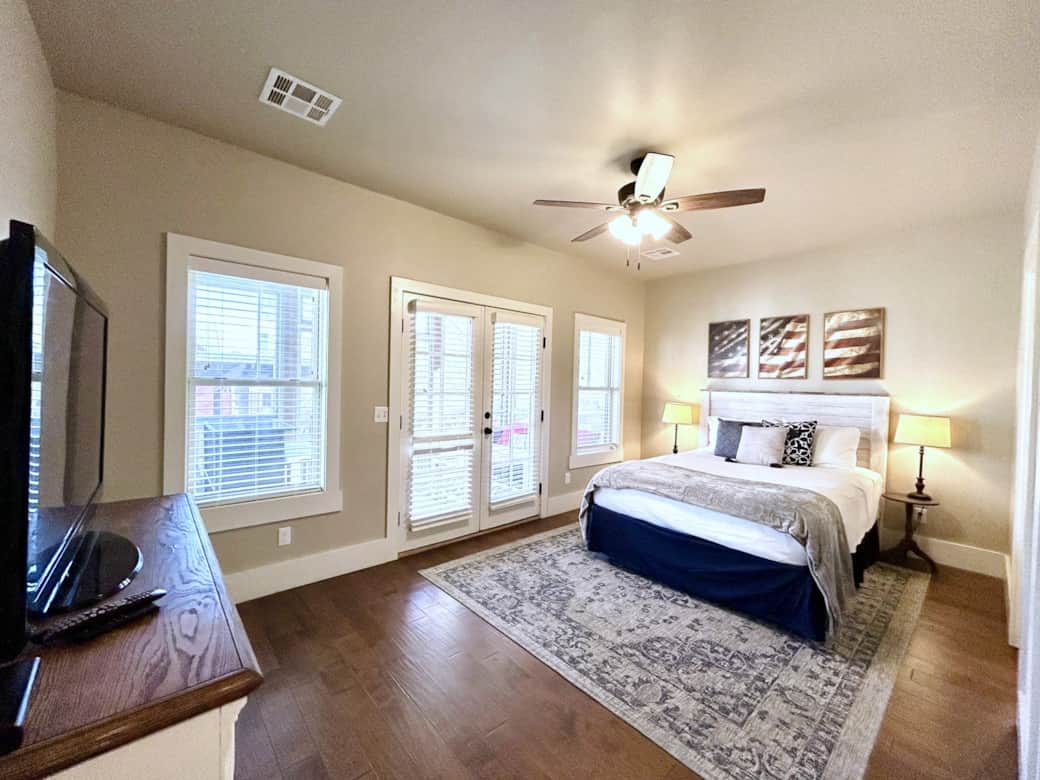 Master boasts a lush queen bed, private bathroom, & white noise machine.