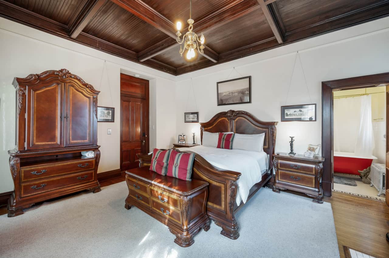 king-suite-accommodation-lynchburg-va.,  with coffee station, mini fridge, microwave, and armoire.
