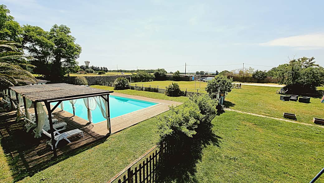 Sunlit swimming pool in the garden