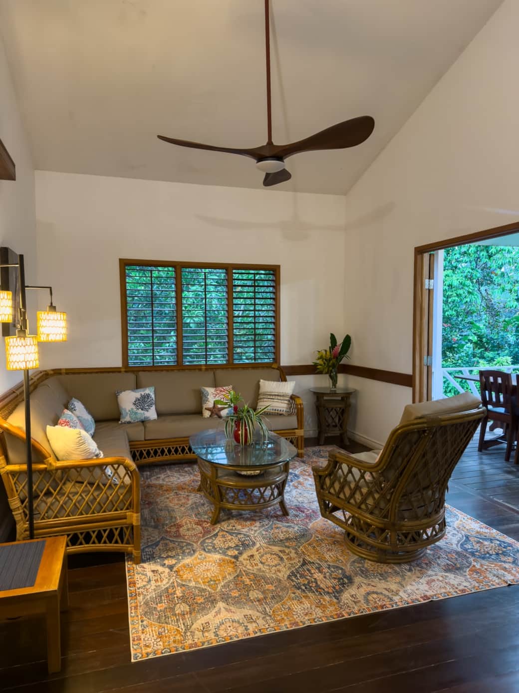 High ceilings and modern ceiling fans keep the living room cool and airy, blending comfort with Caribbean charm in this Bluff Beach vacation home.
