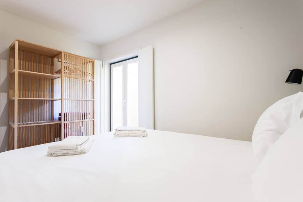 Double door window opens to a small private patio