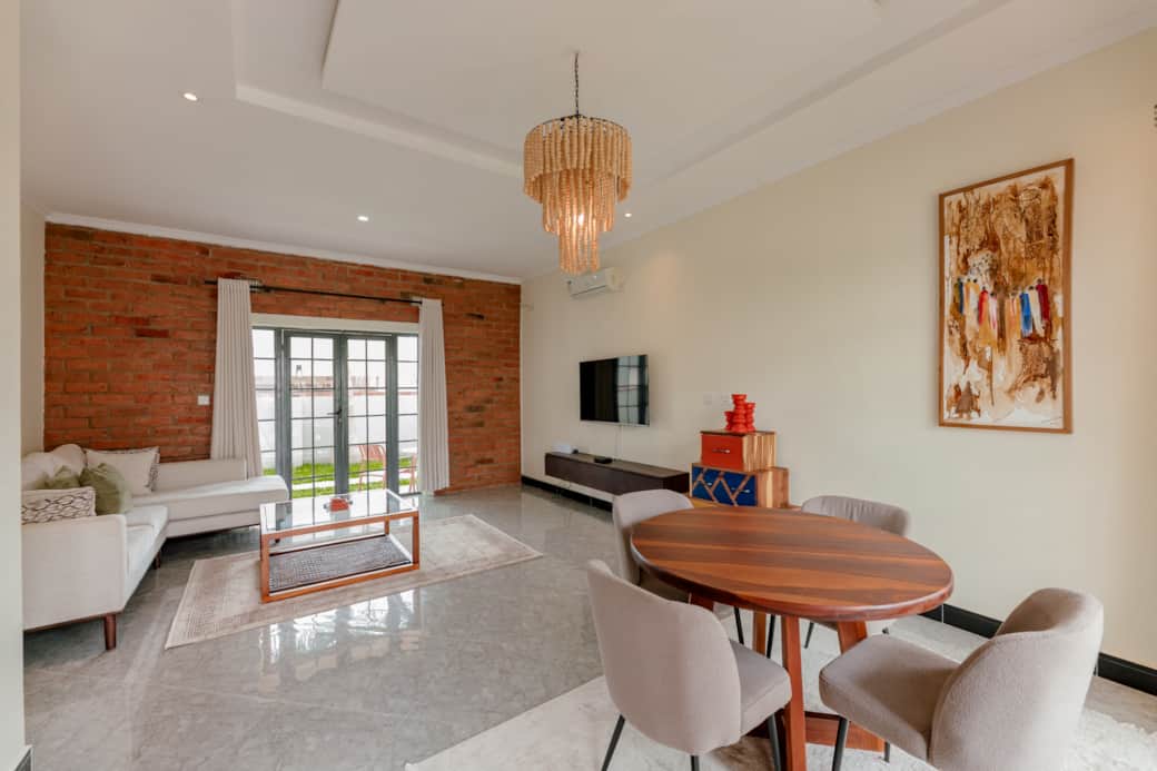 Bright living room with smart TV and dining area