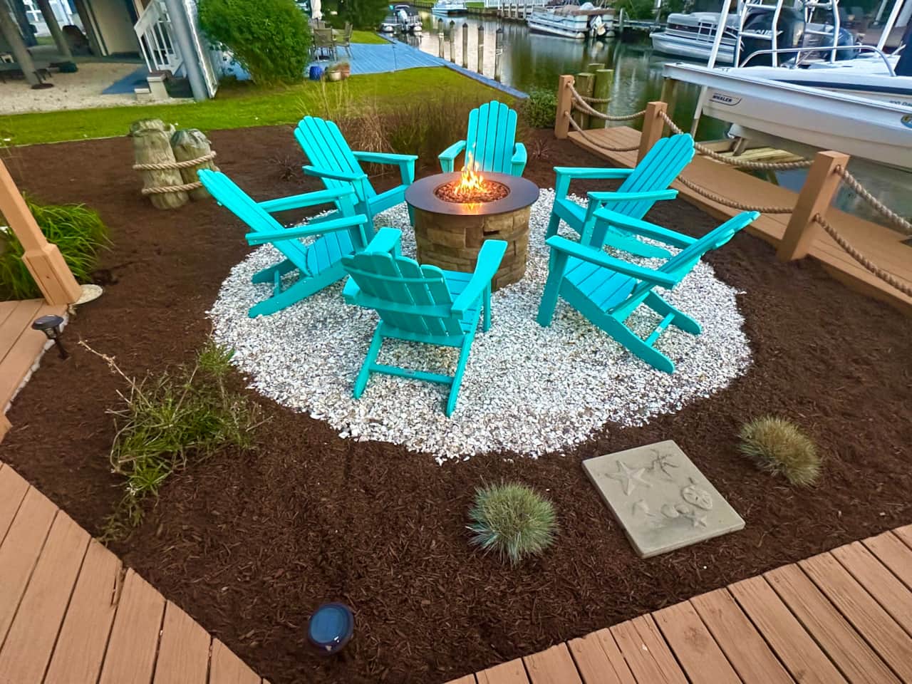 The gas fire-pit on the canal! 6 Adirondack chairs.