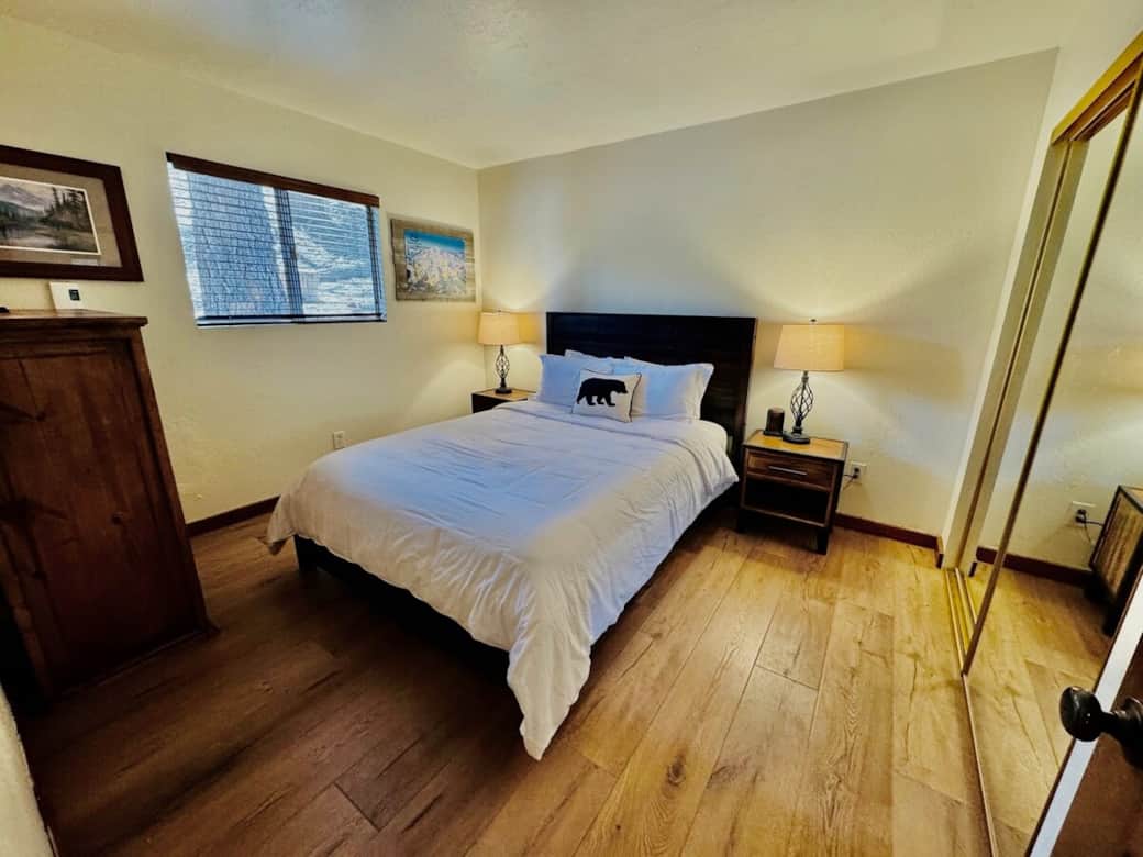 2nd bedroom with window overlooking open woods