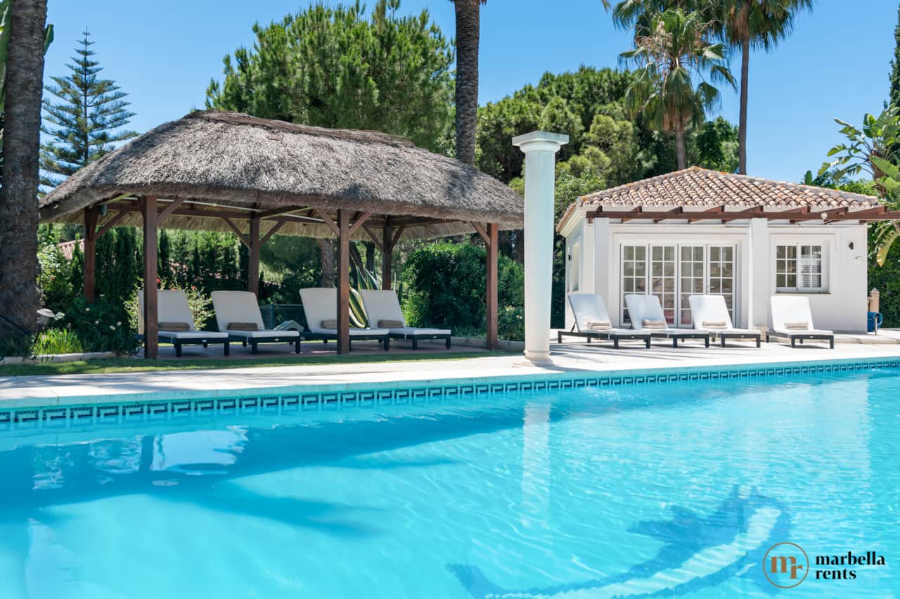 Sun loungers at private pool.