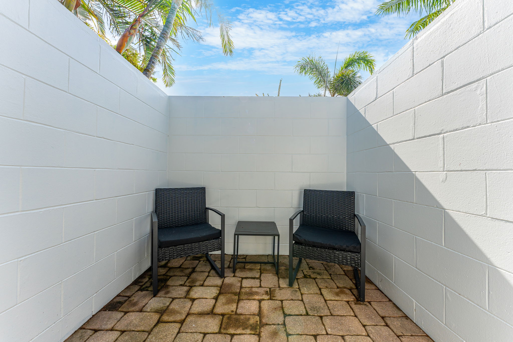 Relax in your own private outdoor space with comfortable seating.