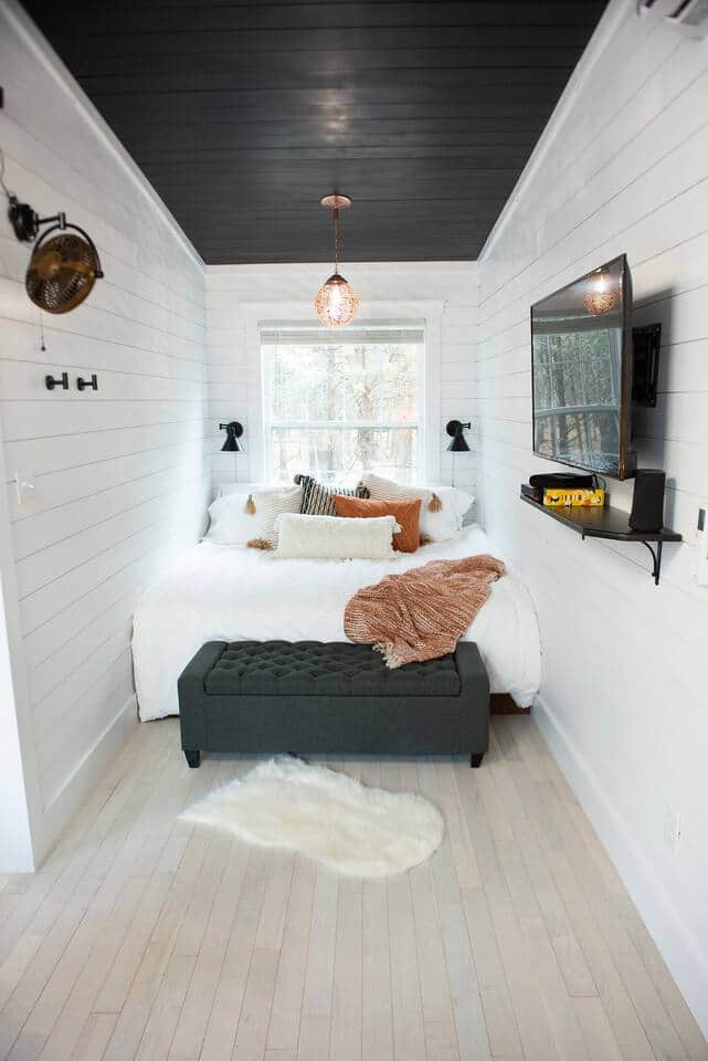 Escape into the semi-enclosed, romantic bedroom cubby featuring a plush, king-sized mattress, luxury linens and a beautiful, shadow and light casting, Moroccan chandelier hanging from above. Enjoy serene forest views from the picture window. Escape into the semi-enclosed, romantic bedroom cubby featuring a plush, king-sized mattress, luxury linens and a beautiful, shadow and light casting, Moroccan chandelier hanging from above. Enjoy serene forest views from the picture window.