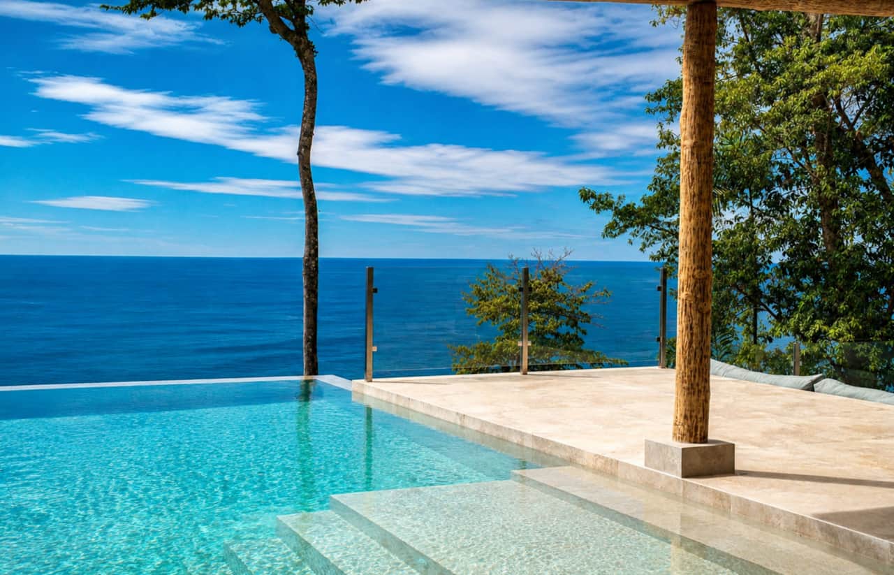 Swim above the jungle in a private infinity pool with endless Pacific Ocean views.