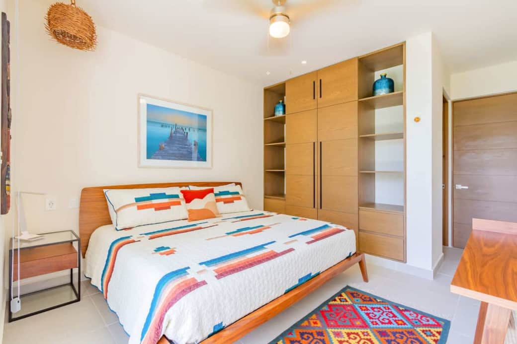 Comfortable and thoughtfully designed bedroom featuring air conditioning, a ceiling fan, room-darkening shades, and generous closet space. Includes a private lock-off bathroom for added privacy and convenience.