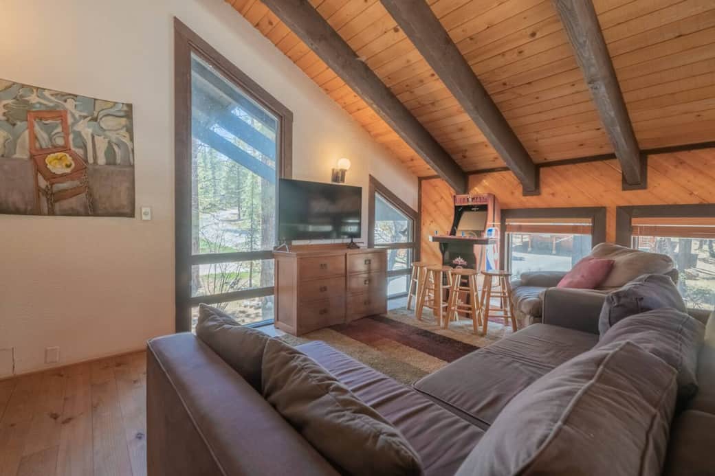 Upstairs loft with comfy couch, TV and arcade games!