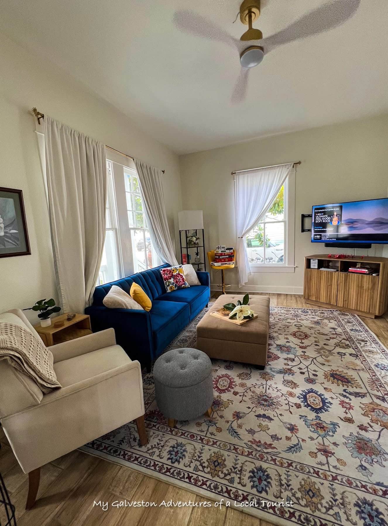 Spacious living room at White Magnolia Galveston vacation rental with modern decor and historic charm.
