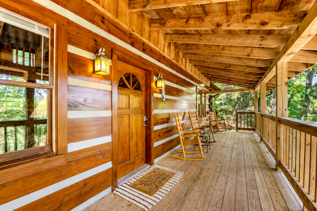 Settle into a rocking chair on the covered porch and enjoy peaceful forest views