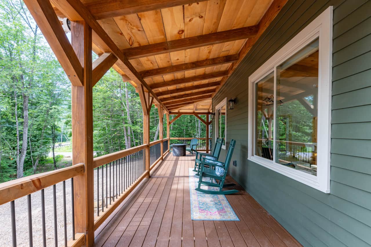 Front Farmer's Porch with two Polywood rockers and side tables