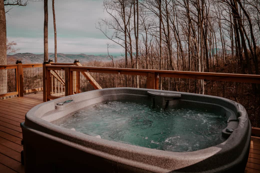 Unwind in the hot tub with a stunning backdrop of the Smoky Mountains Unwind in the hot tub with a stunning backdrop of the Smoky Mountains